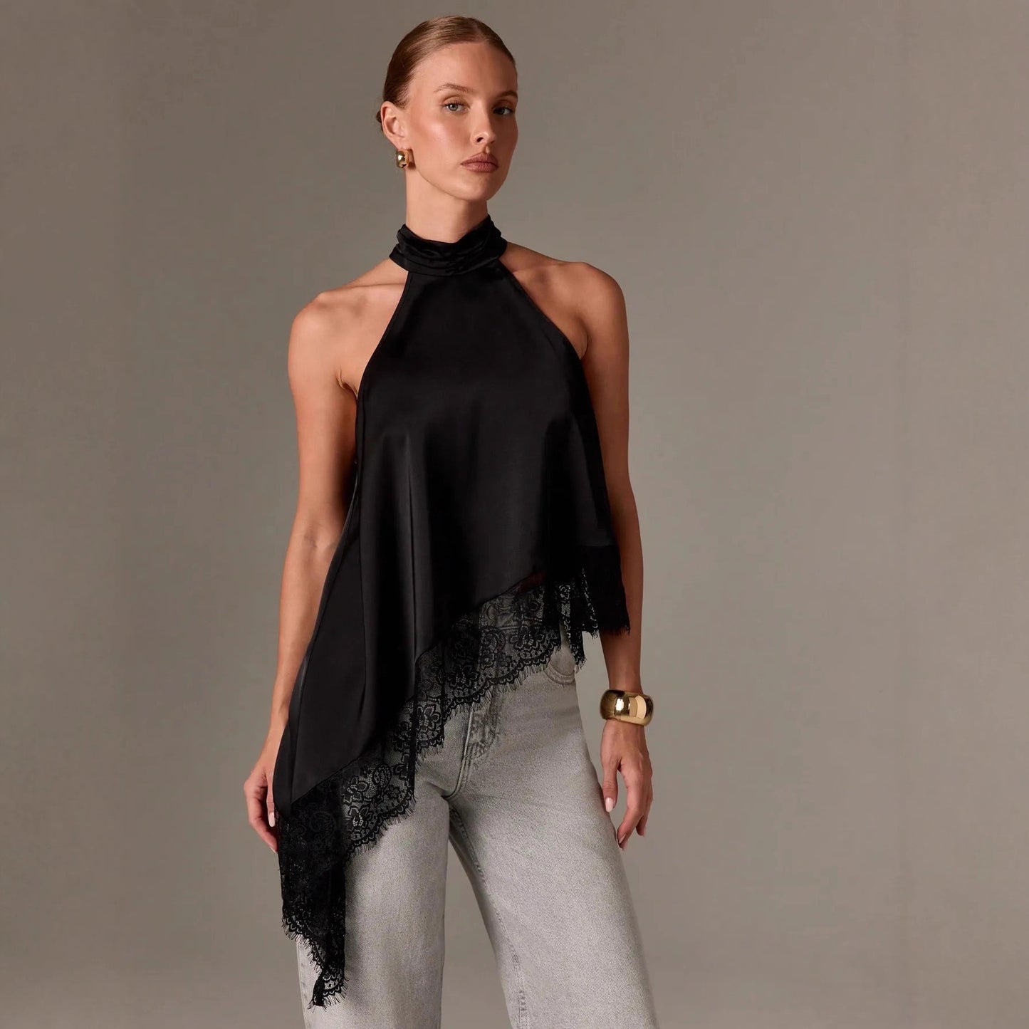 Sleeveless lace-trimmed asymmetrical halter-neck satin vest