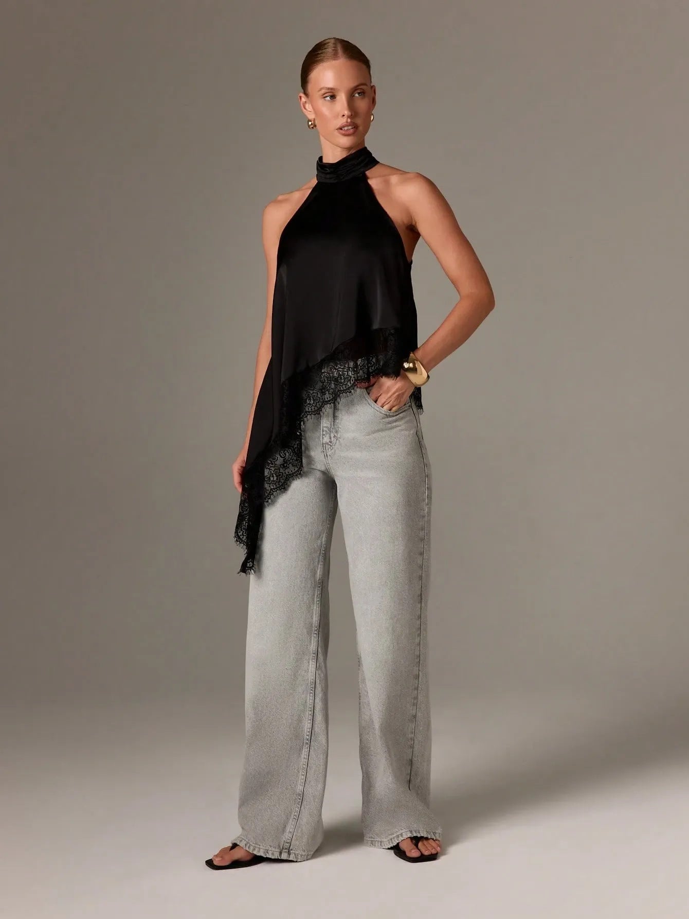 Sleeveless lace-trimmed asymmetrical halter-neck satin vest