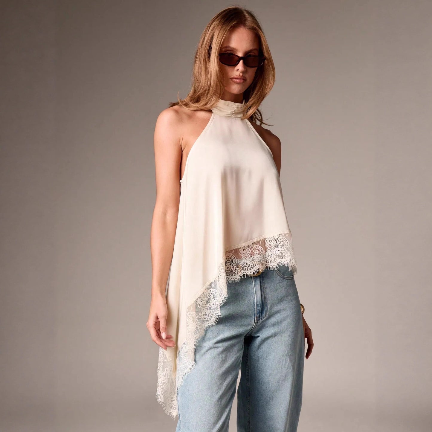 Sleeveless lace-trimmed asymmetrical halter-neck satin vest