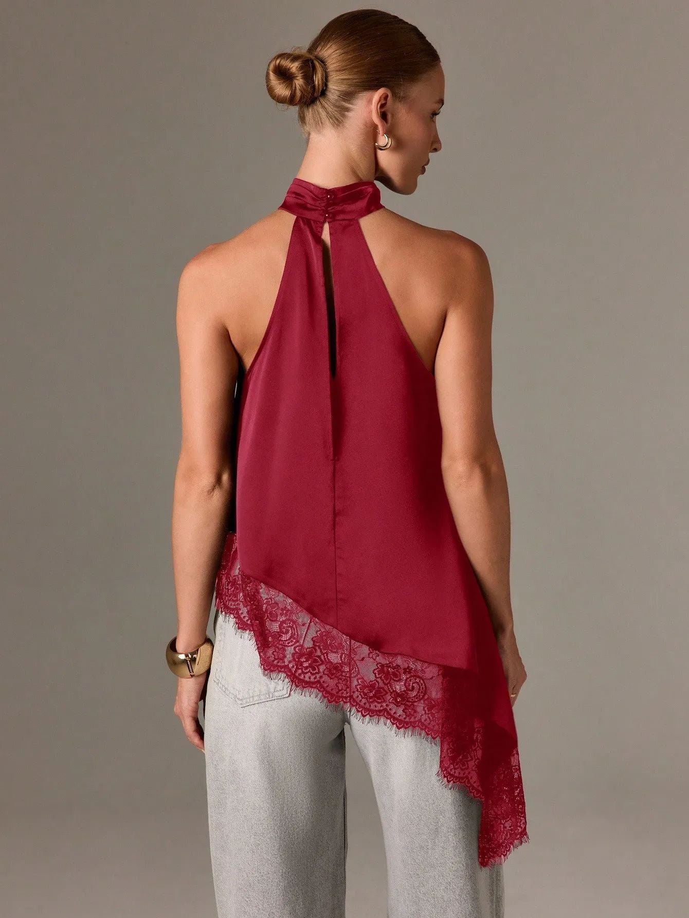 Sleeveless lace-trimmed asymmetrical halter-neck satin vest