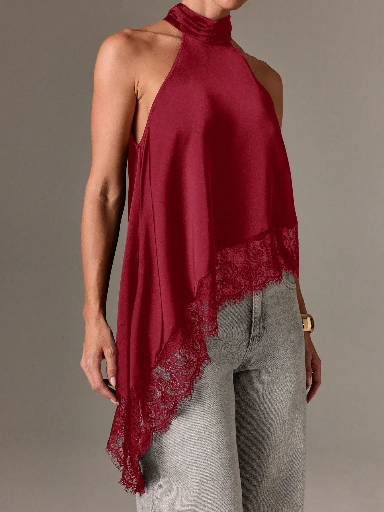 Sleeveless lace-trimmed asymmetrical halter-neck satin vest