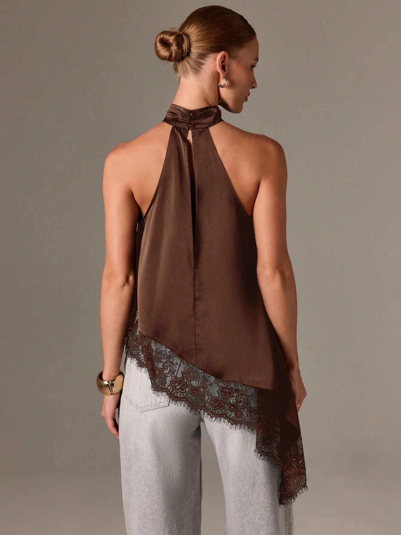 Sleeveless lace-trimmed asymmetrical halter-neck satin vest
